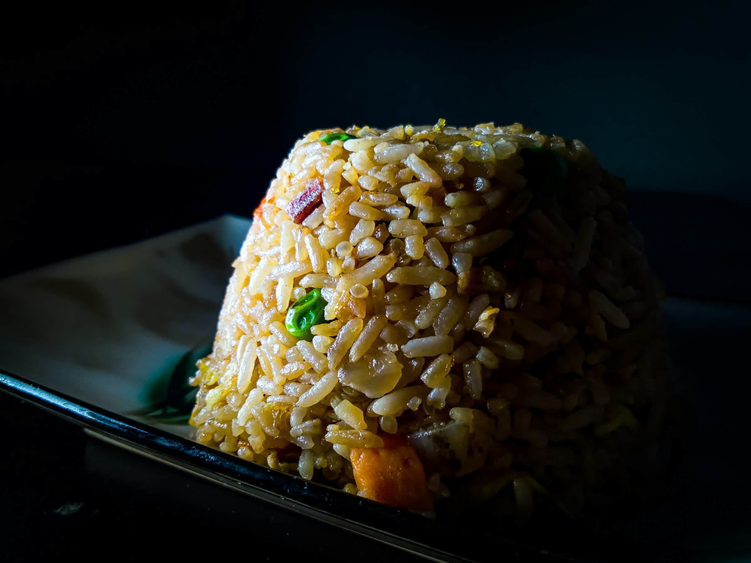 A steaming plate of home-style fried rice